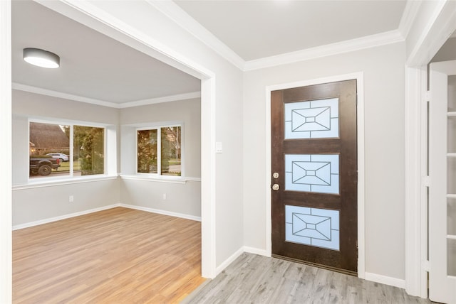 entrance foyer with light wood-type flooring and ornamental molding