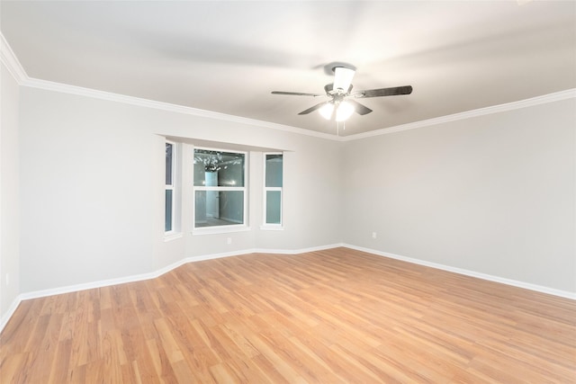 empty room with ceiling fan, crown molding, and light hardwood / wood-style floors