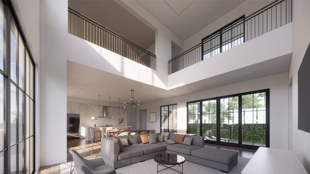 living room with a high ceiling and a chandelier