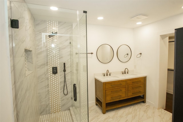 bathroom featuring vanity and a shower with shower door