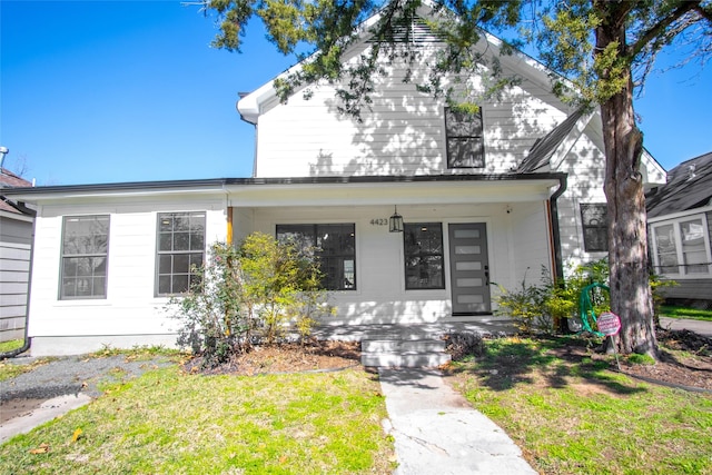 view of front facade with a porch and a front yard