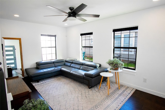 living room with hardwood / wood-style floors and ceiling fan