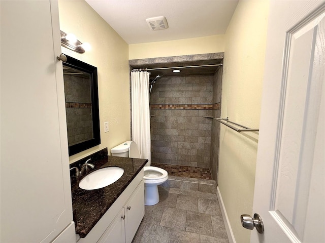 bathroom with vanity, toilet, and a shower with shower curtain