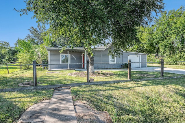 view of front facade featuring a front yard and a garage