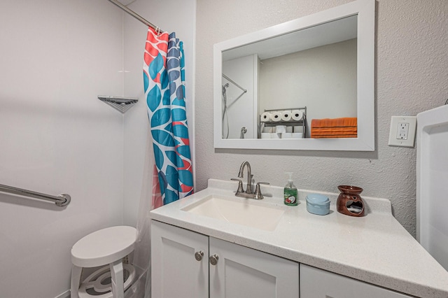 bathroom with vanity and curtained shower