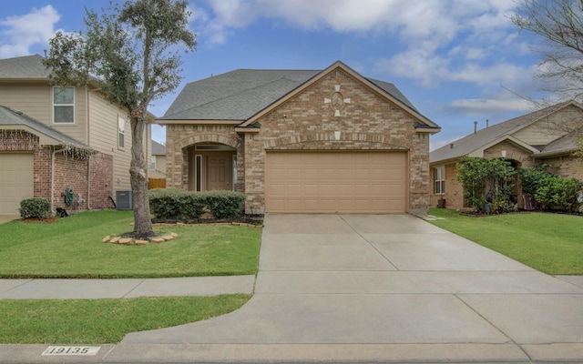 view of front of property with a garage and a front yard