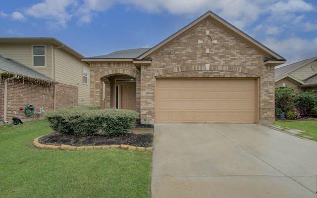 view of front facade with a garage and a front yard