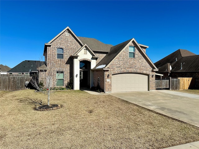 view of front of house with a garage and a front yard