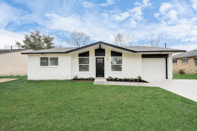 single story home featuring a front lawn and a garage