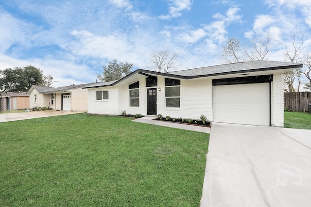 single story home featuring a front yard and a garage