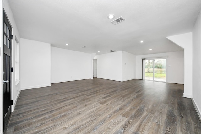 empty room with dark hardwood / wood-style floors