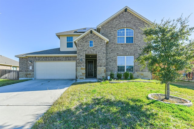 view of front of home with a garage and a front yard