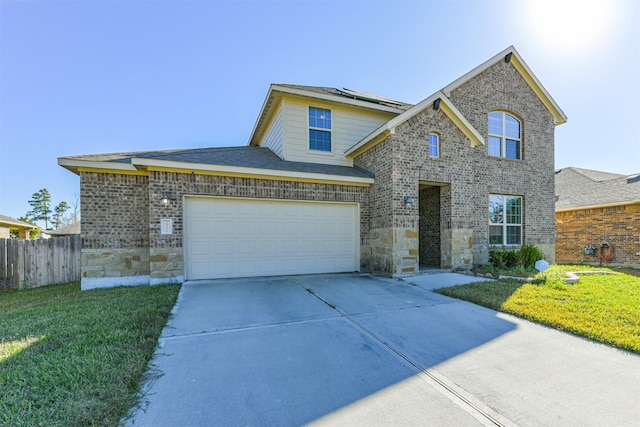 view of front of property featuring a garage and a front yard