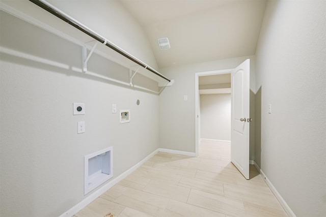 clothes washing area featuring gas dryer hookup, washer hookup, and hookup for an electric dryer