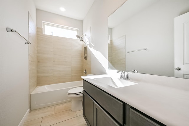 full bathroom with vanity, toilet, and tiled shower / bath