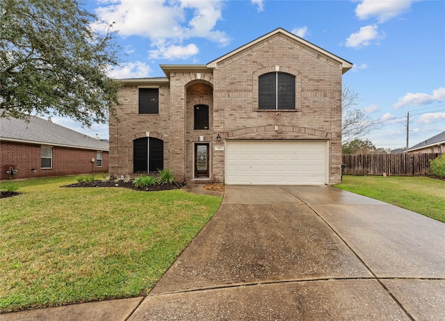 view of front of home featuring a garage and a front yard