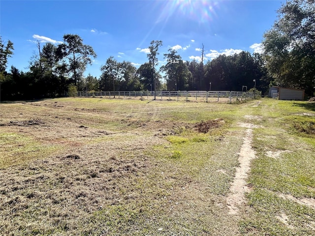 view of yard with a rural view