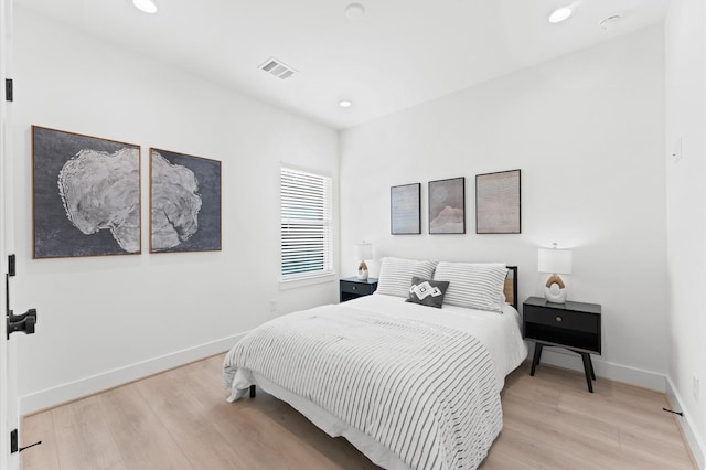 bedroom with light hardwood / wood-style floors