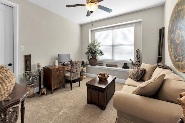 home office with light carpet and ceiling fan