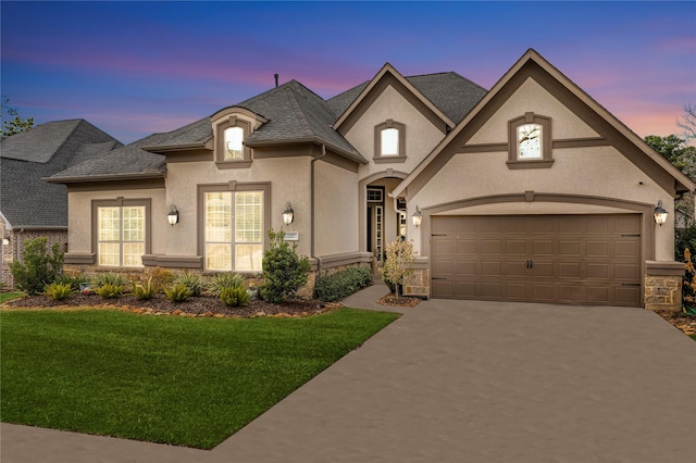 french country home featuring a lawn