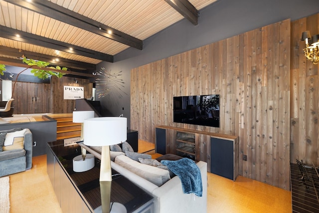 living room featuring beam ceiling and wooden walls