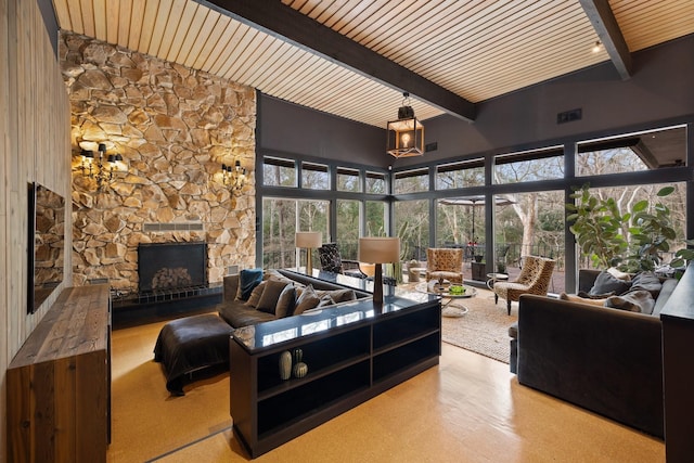 living room with high vaulted ceiling, beamed ceiling, and a fireplace