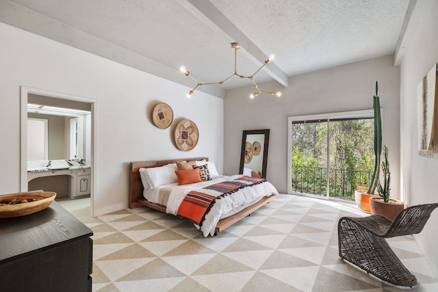 bedroom featuring beam ceiling, connected bathroom, a notable chandelier, and a textured ceiling