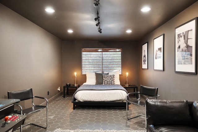 bedroom featuring rail lighting