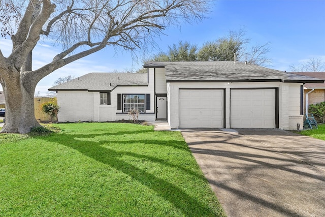 single story home featuring a front yard and a garage