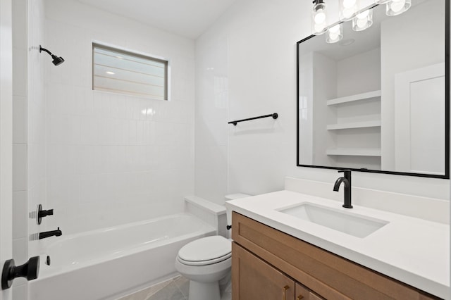 full bathroom featuring tiled shower / bath, vanity, and toilet