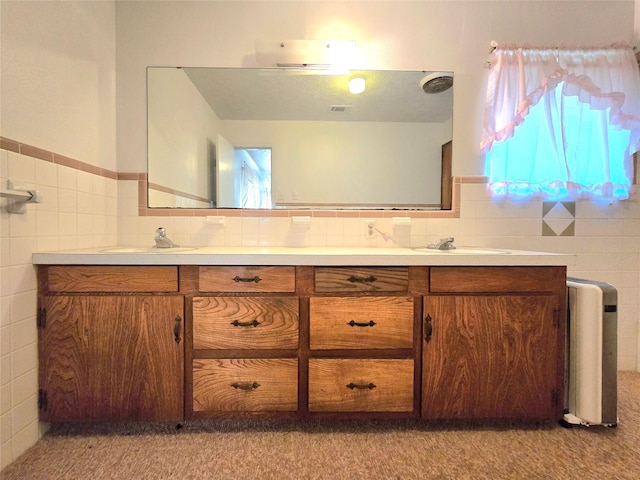 bathroom featuring tile walls and vanity