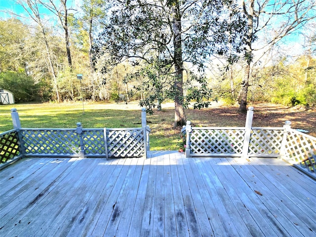 wooden terrace with a yard