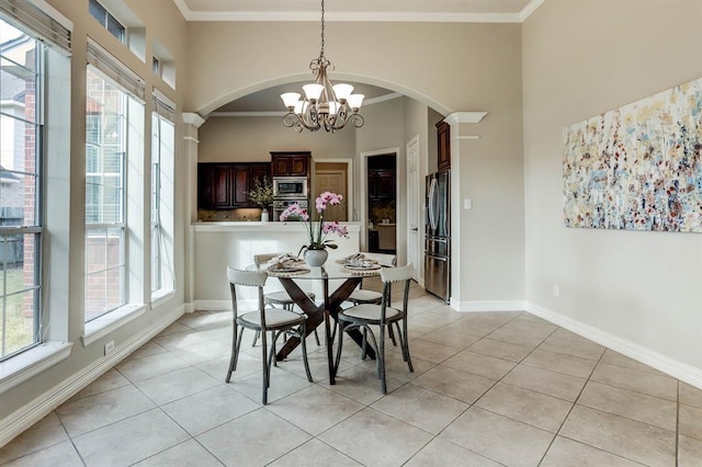 dining room featuring light tile patterned floors, plenty of natural light, and a chandelier