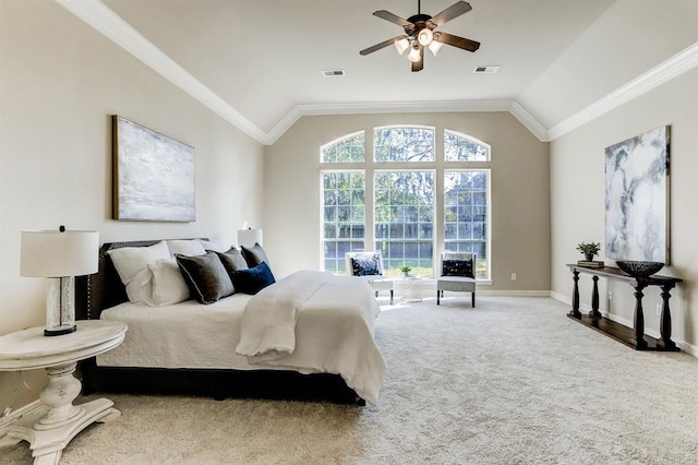 bedroom with vaulted ceiling, ceiling fan, carpet, and ornamental molding