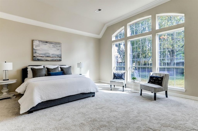 bedroom featuring carpet, vaulted ceiling, ornamental molding, and multiple windows