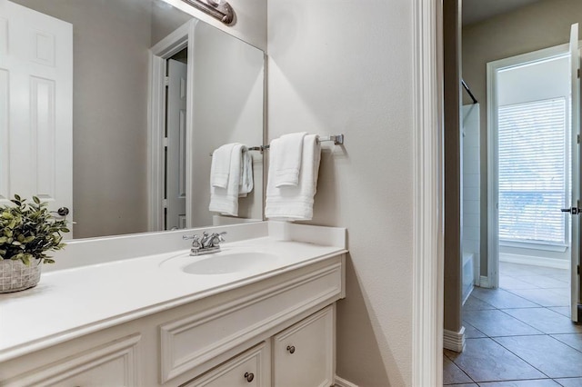 bathroom featuring tile patterned flooring and vanity