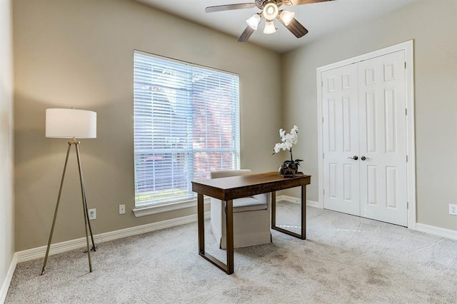 office with light carpet and ceiling fan