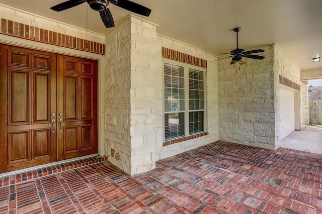 property entrance with ceiling fan and a porch