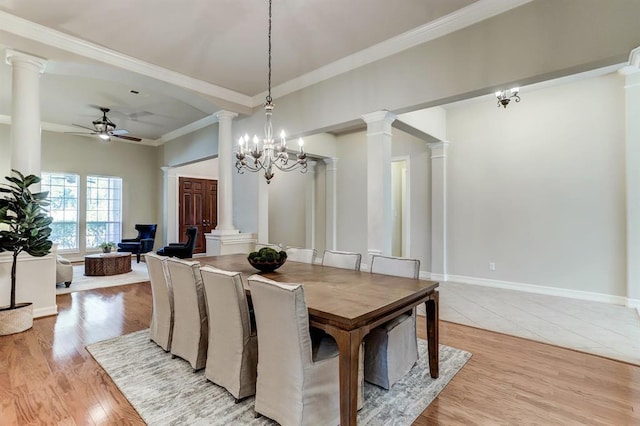 dining space with crown molding, ceiling fan with notable chandelier, and light hardwood / wood-style floors