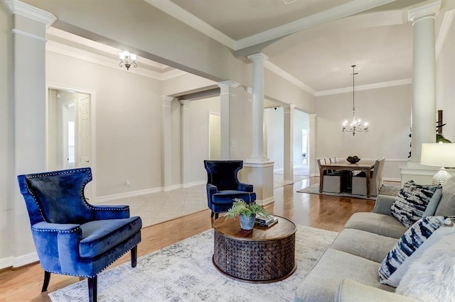 living room featuring a notable chandelier, crown molding, and light hardwood / wood-style flooring