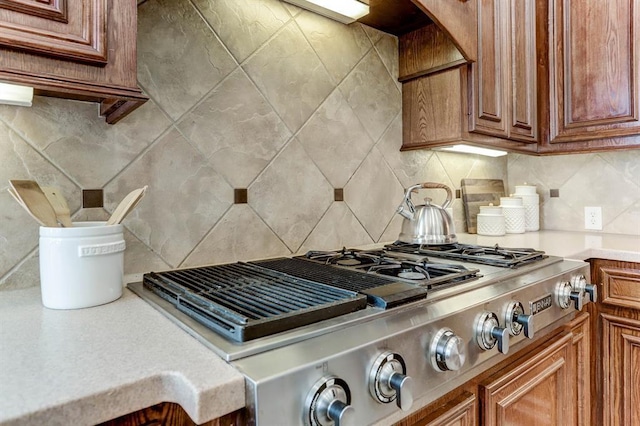 kitchen featuring stainless steel gas cooktop and tasteful backsplash