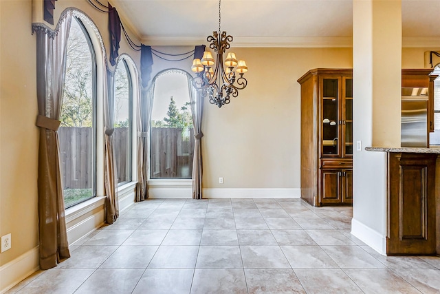 unfurnished dining area featuring crown molding, light tile patterned flooring, and an inviting chandelier