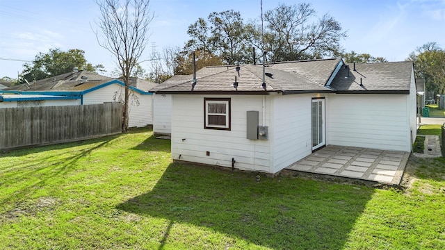 rear view of house with a lawn