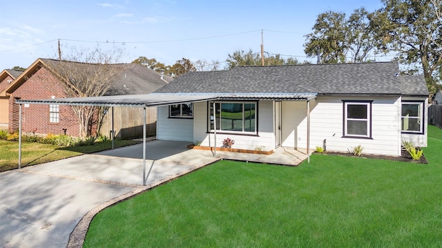 single story home featuring a carport and a front yard