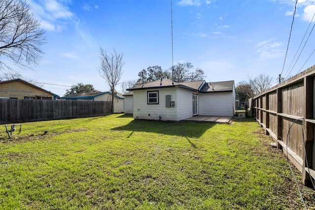 back of property with a patio area and a lawn