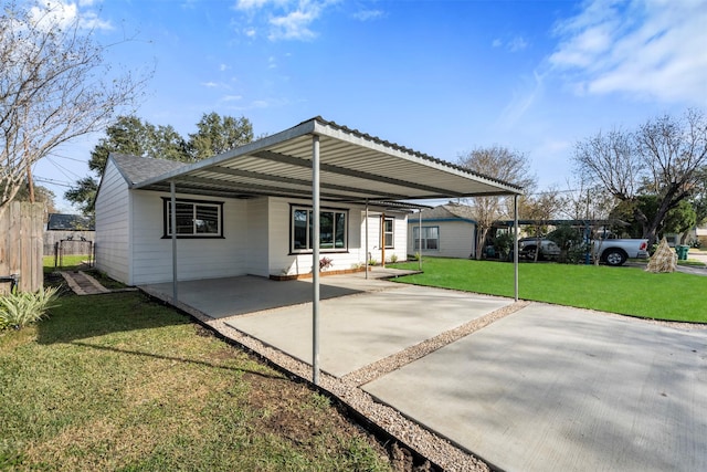 view of front of house featuring a front yard and a carport