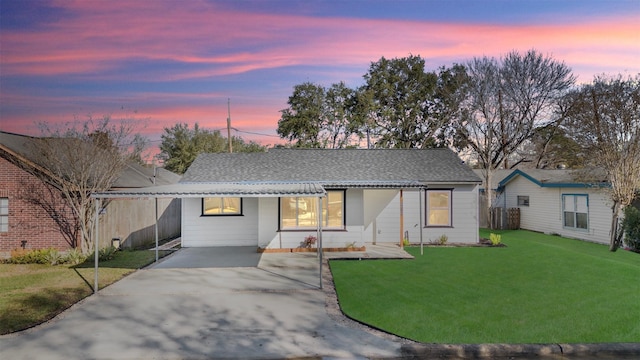 ranch-style house with a lawn