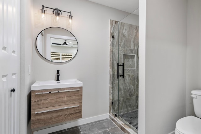 bathroom featuring tile patterned flooring, toilet, vanity, and walk in shower