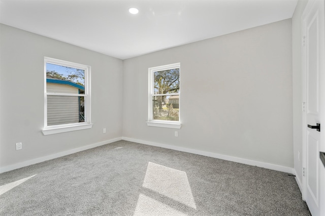 unfurnished room featuring carpet