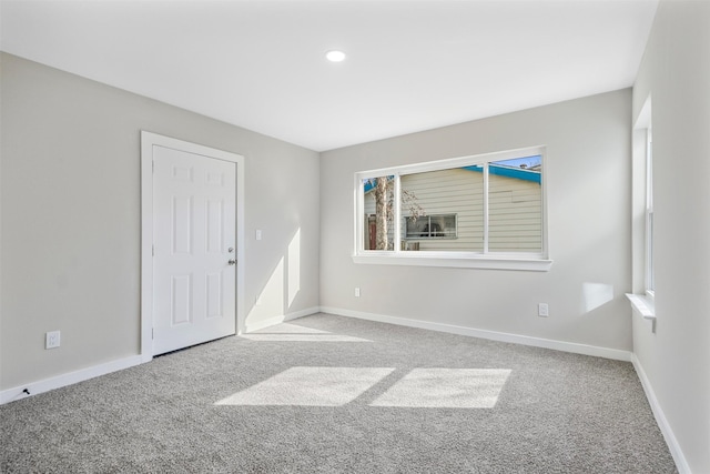 unfurnished room featuring carpet